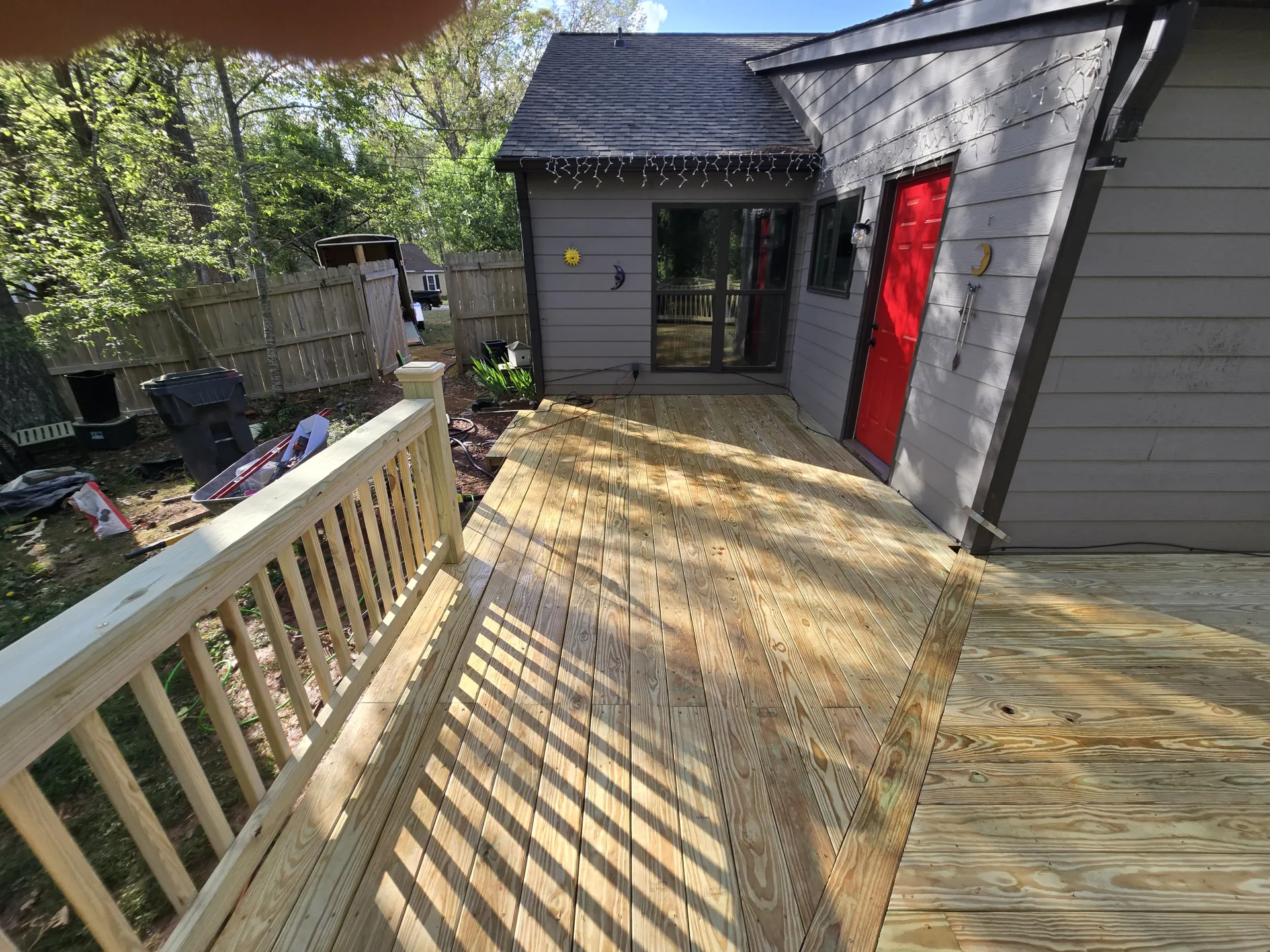 Completed deck with wood railings