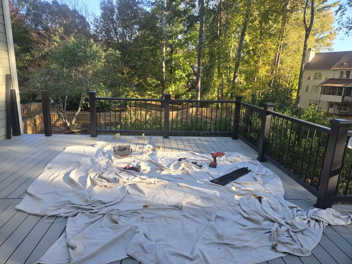 Completed gray composite deck with black railings showing quality craftsmanship