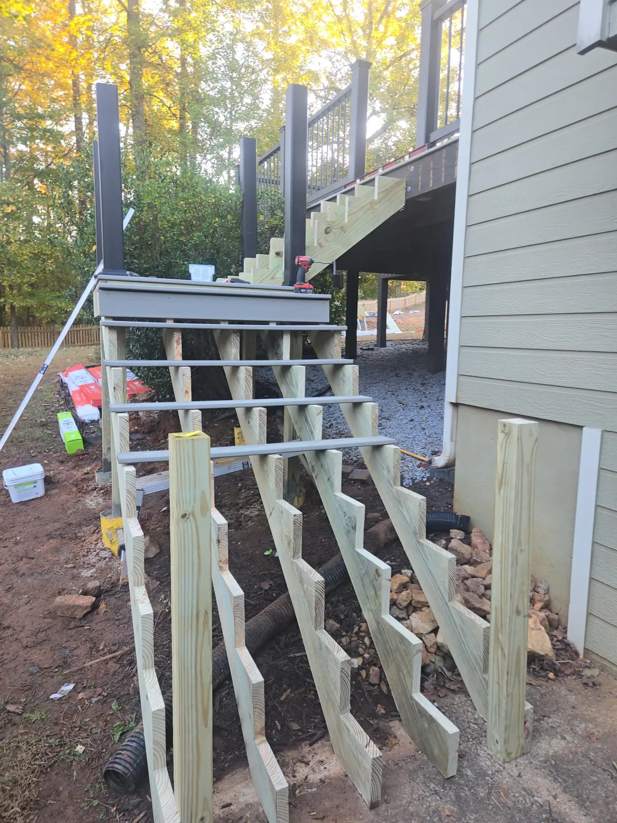 Stair stringers installed on gray composite deck