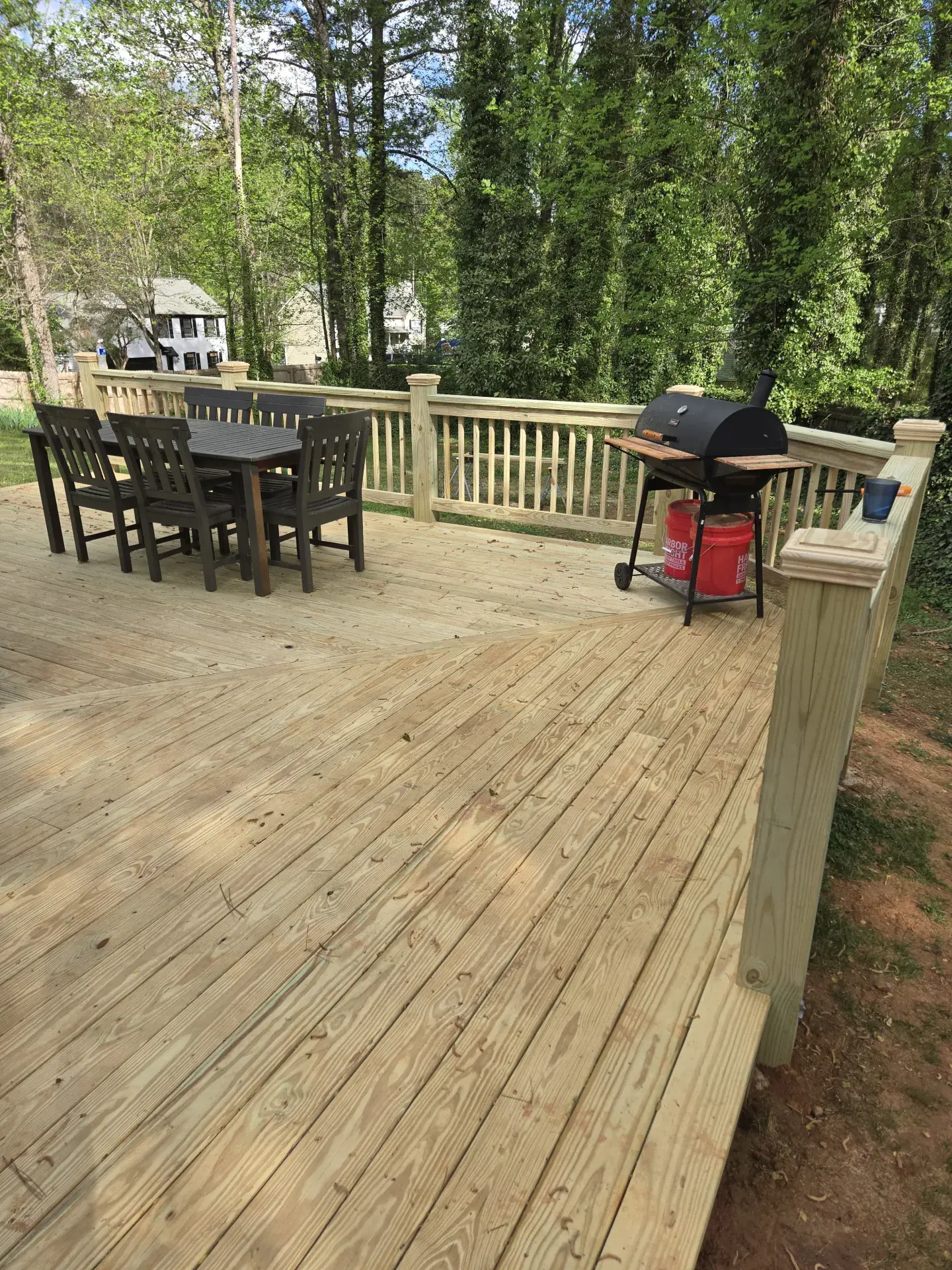Deck with dining furniture and grill