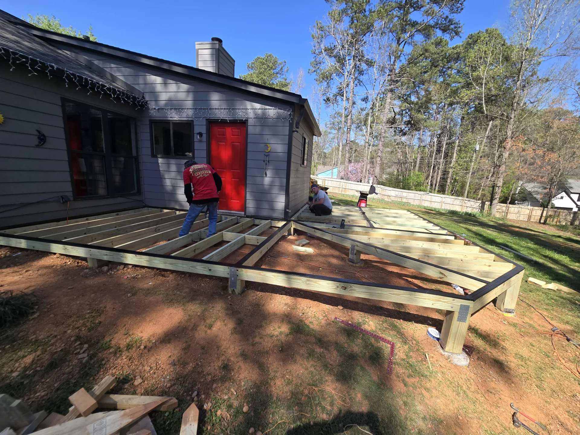Workers installing deck joists