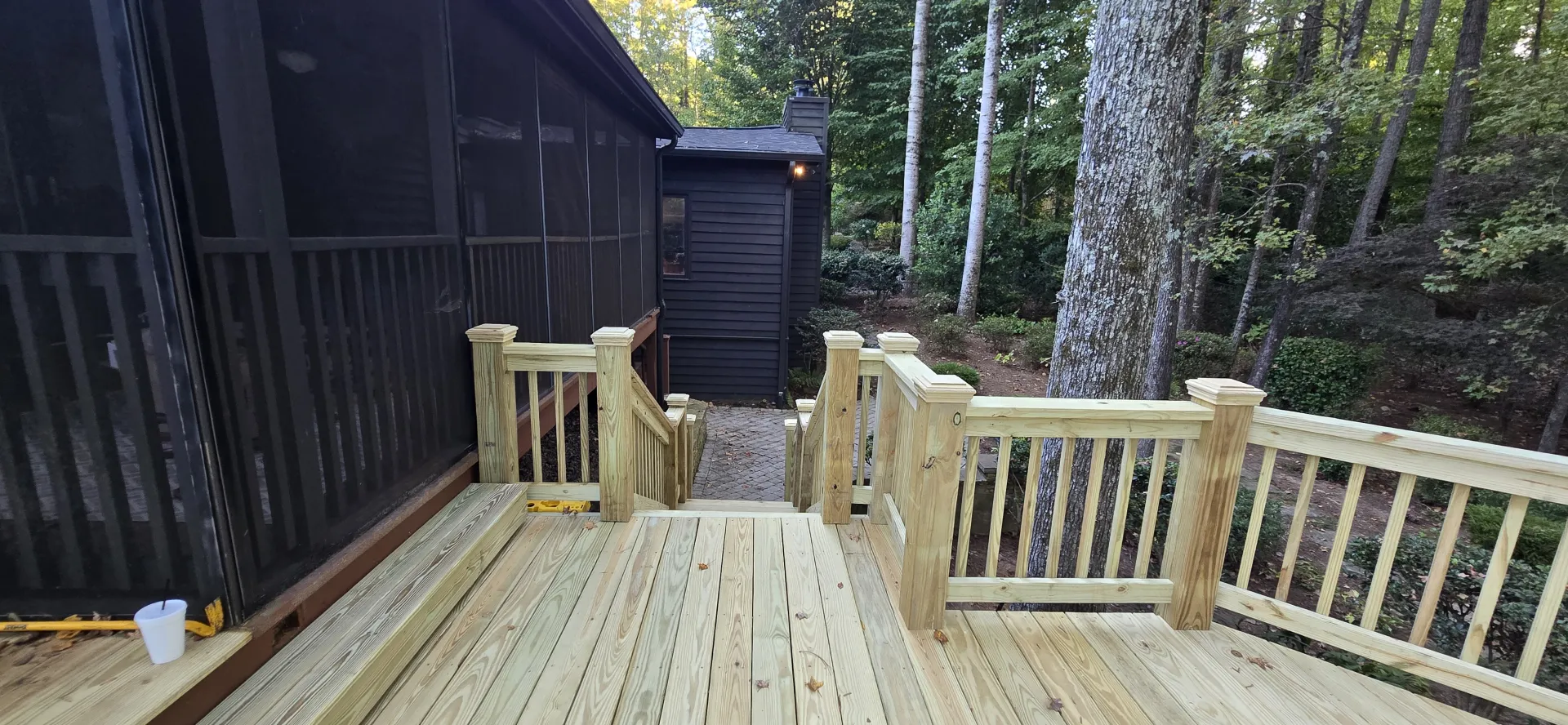 Deck stairs leading to brick paver walkway