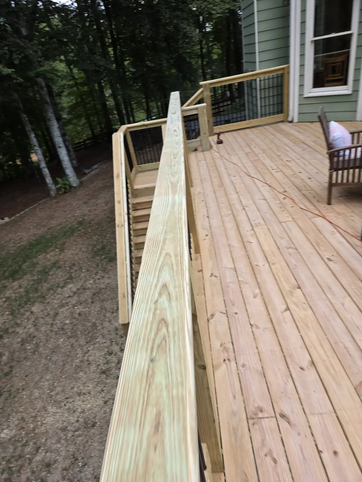 Deck stairs in wooded setting