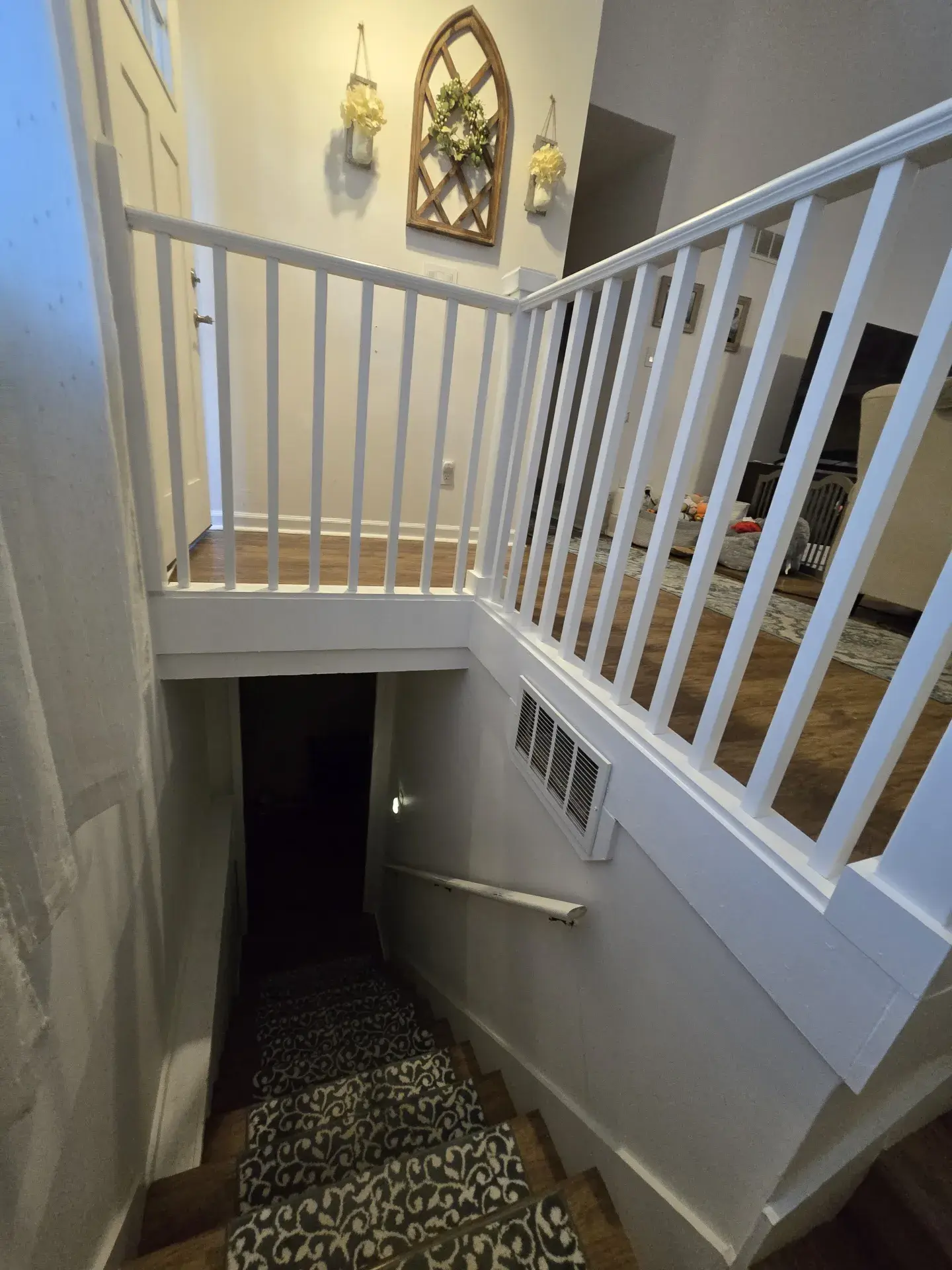 Interior stairwell with white railings