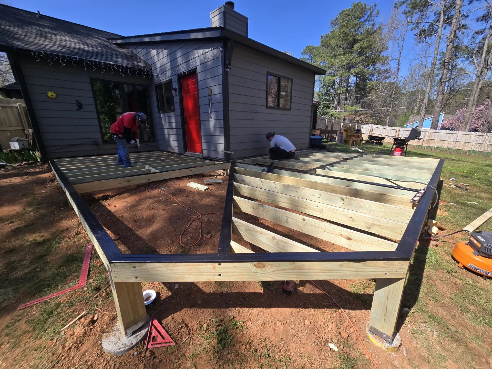 L-shaped deck framing wrap-around design