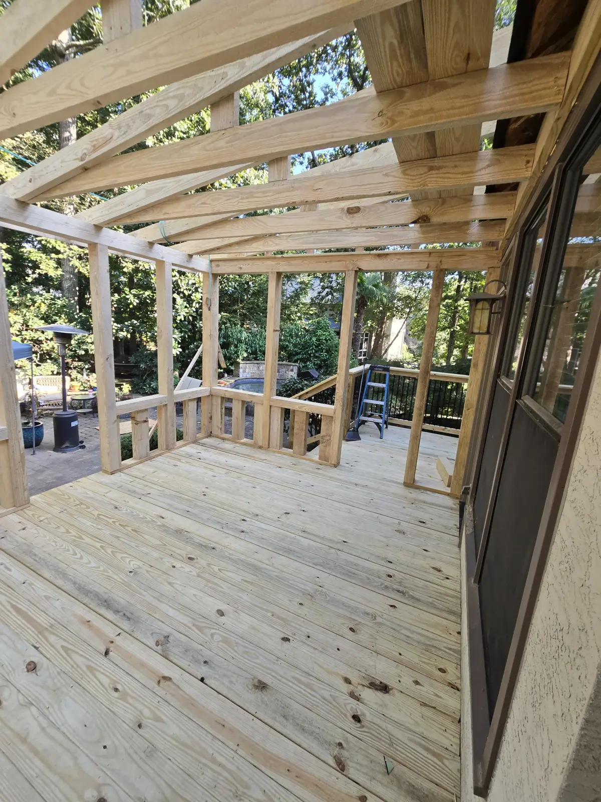 Porch roof framing detail attached to house
