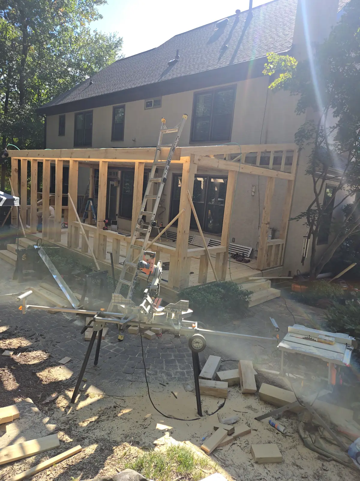 Large screened porch framing under construction