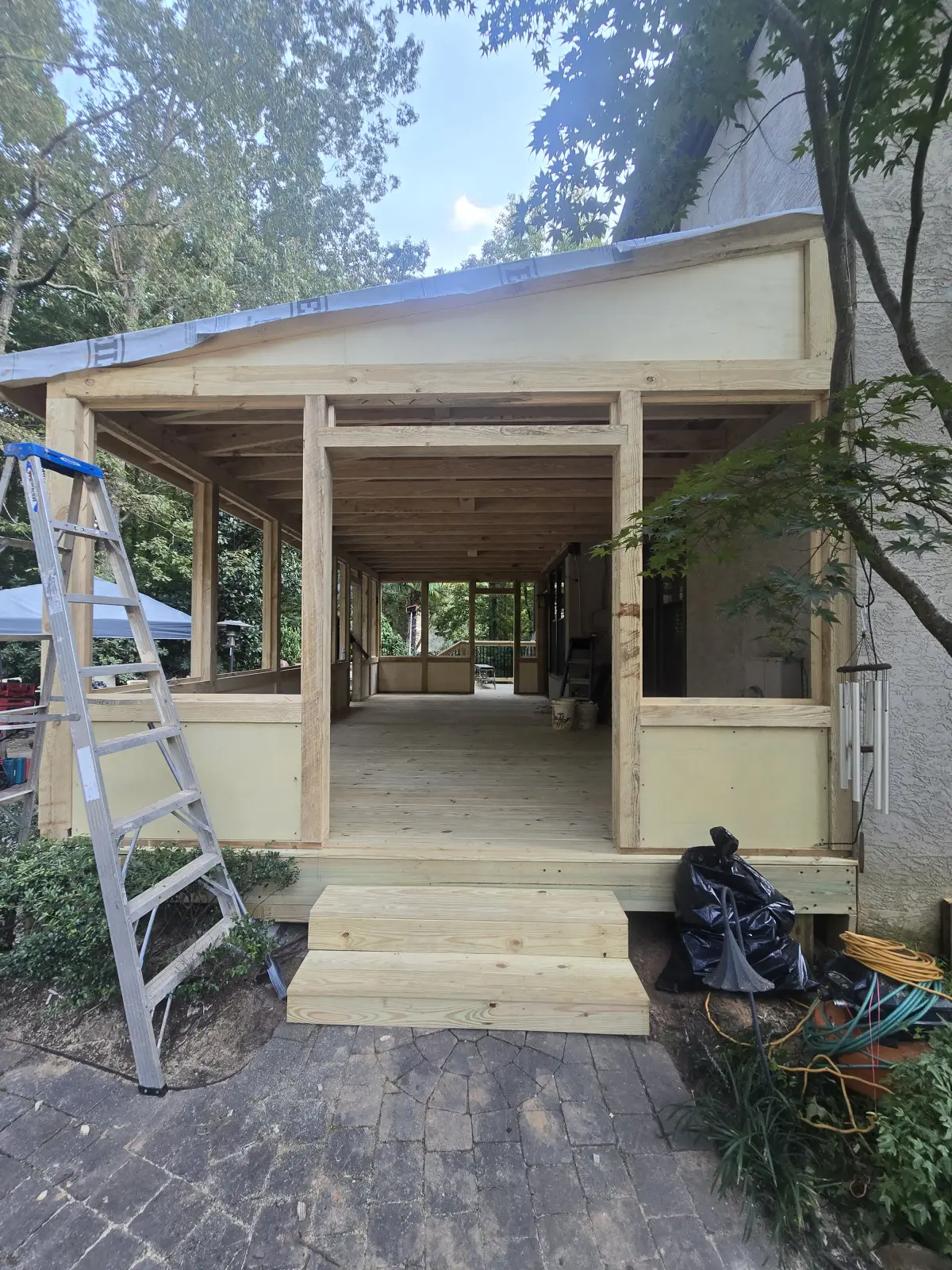 Screened porch structure exterior with framing complete
