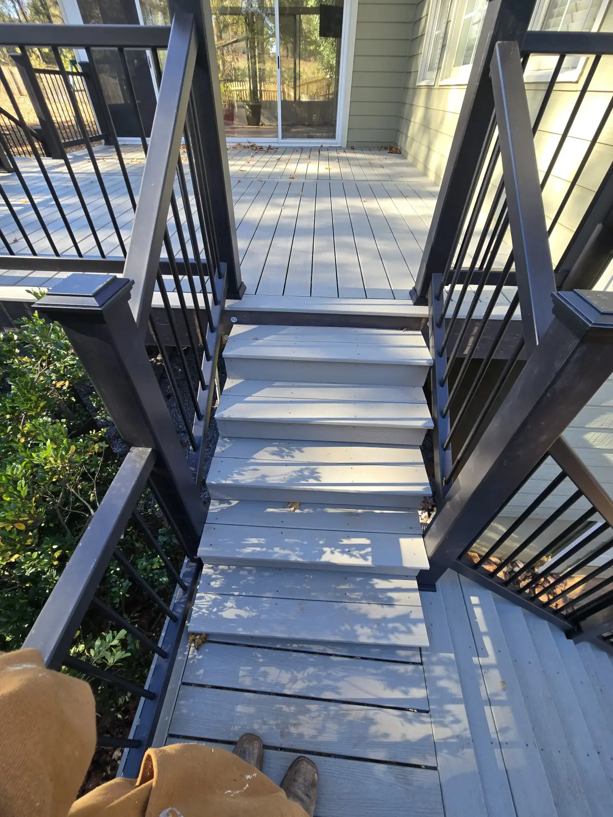 Deck stairs showing landing with directional change