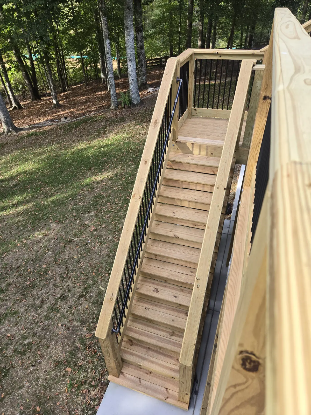 Staircase with black railings